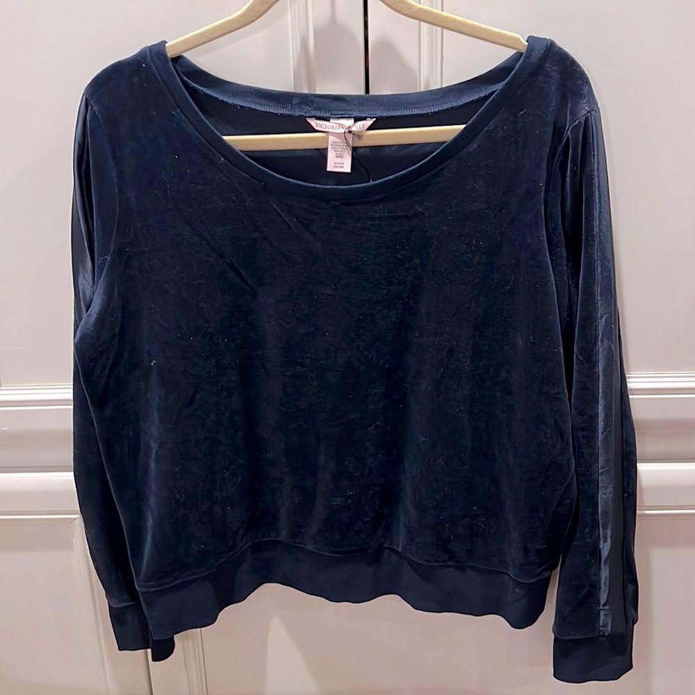 Navy blue velour sweatshirt with navy blue satin racing stripe down the arm.